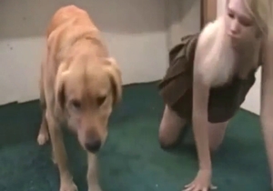 Blond-haired diva teasing the dog on the floor